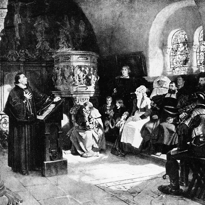 Szene mit Martin Luther, der auf der Wartburg aus der Bibel vorliest